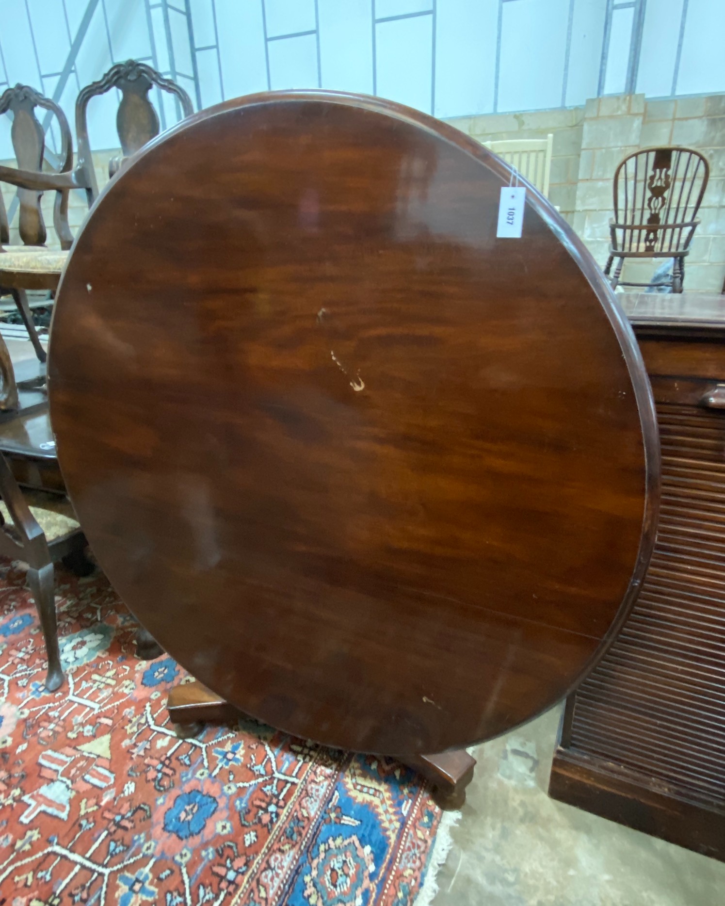 An early Victorian mahogany circular tilt top breakfast table, diameter 140cm, height 72cm